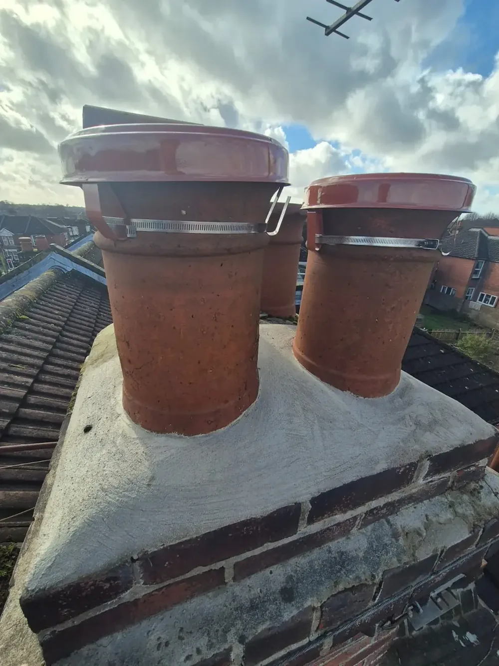 Chimney pots re-set on a rebuilt stack