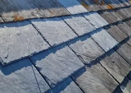 Slate roof repair — new slates blended in